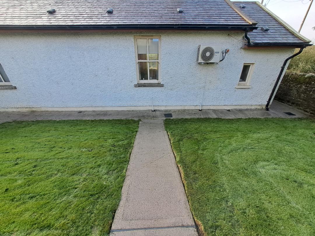 Before and after exterior cleaning Kildare: concrete path pressure washed, after