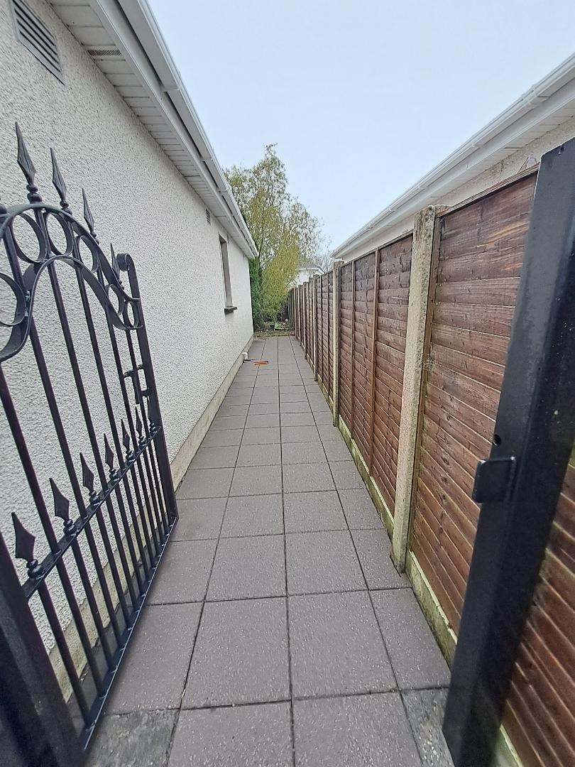Before and after exterior cleaning Kildare: side passage and gate cleaned, after