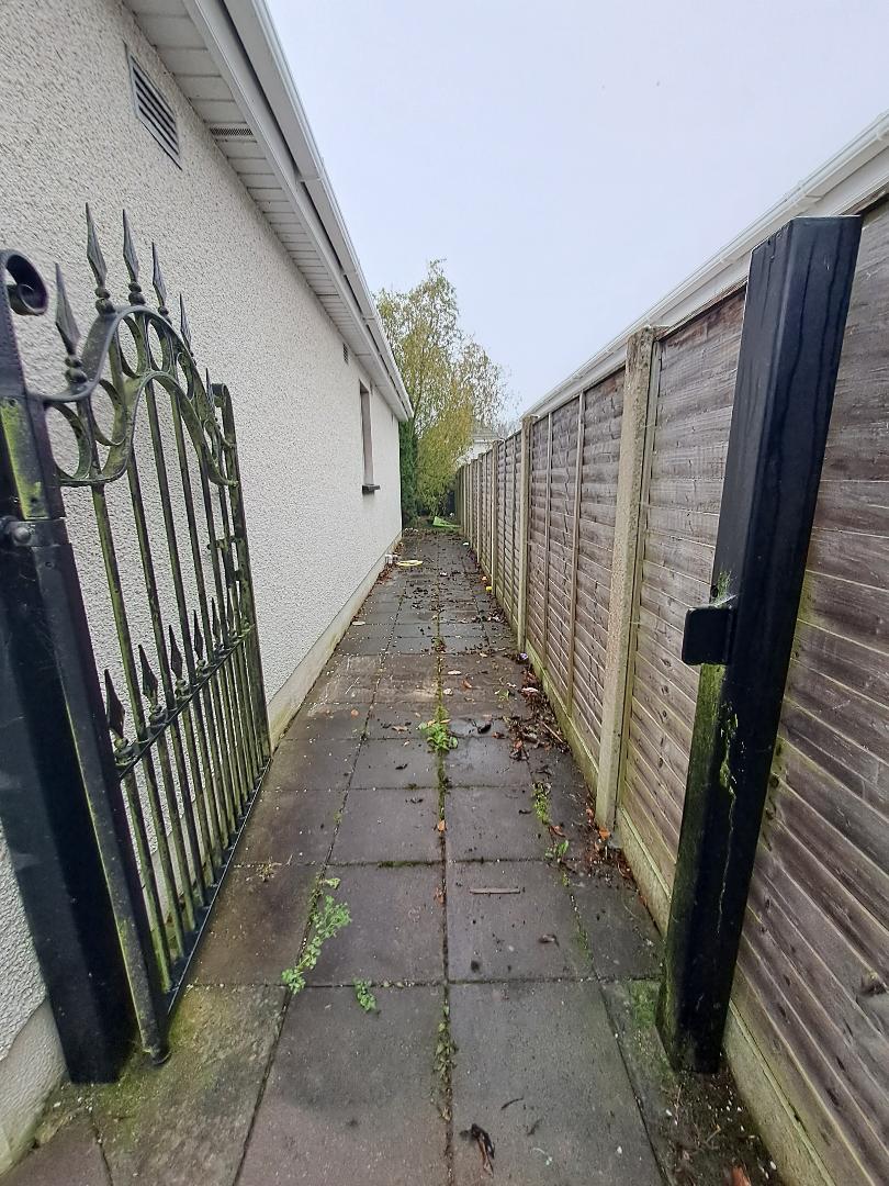 Before and after exterior cleaning Kildare: side passage and gate cleaned, before
